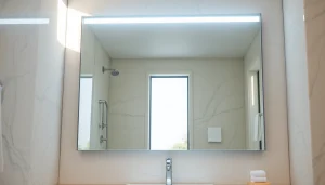 Enhance your space with mirror and led lights reflecting elegance and style in a modern bathroom.